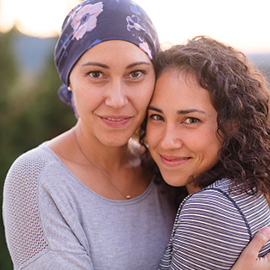 Caucasian mom and daughter hugging