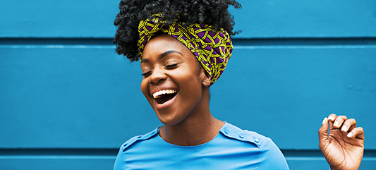 African American woman smiling and laughing joyfully